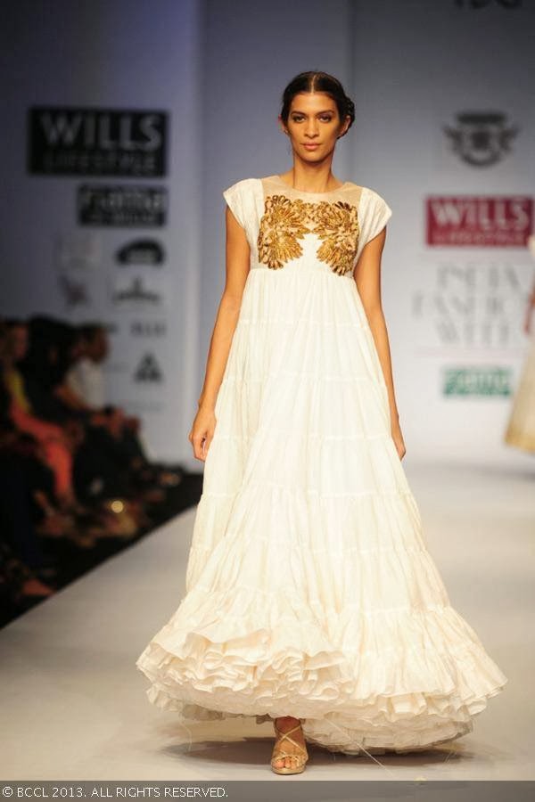 A model showcases a creation by fashion designer Samant Chauhan on Day 2 of Wills Lifestyle India Fashion Week (WIFW) Spring/Summer 2014, held in Delhi.