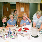 Click to Expand Helene holds up Auction money. Roy Ellen is still adding. Paula and Virginia Melton assist.