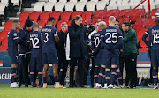 Head Coach Thomas Tuchel of Paris Saint Germain talks with his players during the confusion following an alleged incident between Istanbul Basaksehir assistant manager Pierre Achille Webo and the 4th official during the UEFA Champions League Group H stage match between Paris Saint-Germain and Istanbul Basaksehir at Parc des Princes on December 8, 2020 in Paris, France.