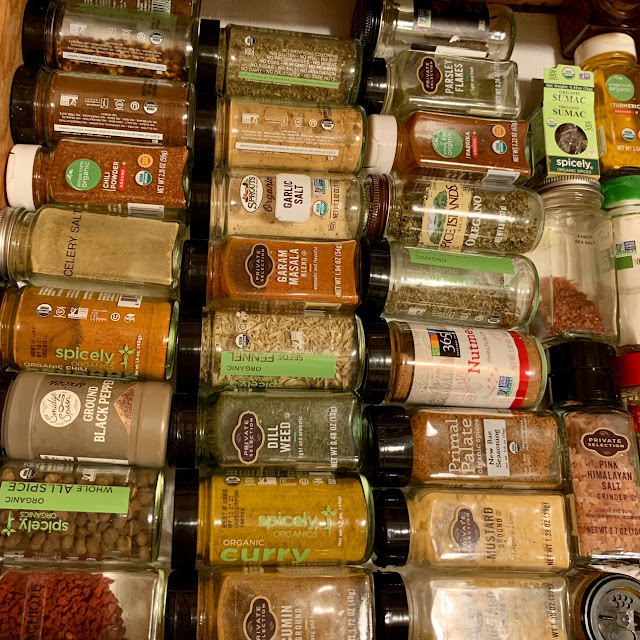 an alphabetized spice drawer