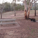 There are several picnic tables and fire places