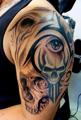 skull tribal tattoos designs on the arm
