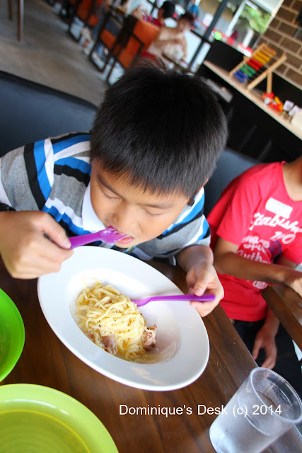 Monkey boy eating their Spaghetti Carbonara
