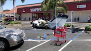 The debris of a plane which crashed into a parking lot is seen in Santa Ana, California, U.S. August 5, 2018 in this still image taken from a video obtained from social media. 