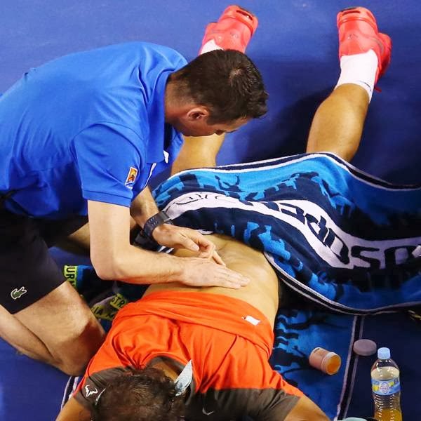  Nadal's problems mounted when he grabbed his back after playing a forehand. He called for the trainer at the next changeover and went off the court for a medical timeout at 2-1 in the second set.