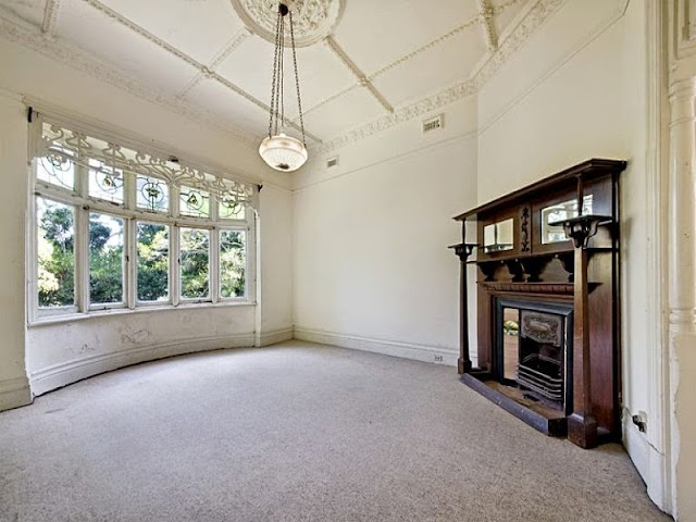 Beautiful Art Nouveau leadlight and cornice, and sympathetic fireplace surround in a Voyseyesque style