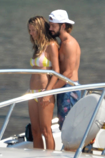 Heidi Klum Topless Sunbathing In Italy