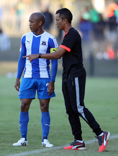 Maritzburg United captain Kurt Lentjies listens to caretaker coach Fadlu Davids during the Absa Premiership match against Cape Town City FC at Harry Gwala Stadium on May 01, 2017 in Durban, South Africa.