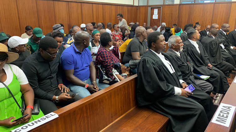 Some of the 64 alleged riot instigators in the Durban high court.