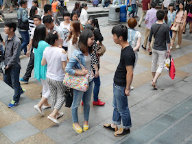 young man and woman talking to each other