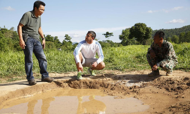 WWF's Nikhil Advani and Wayuphong Jitvijak, and a park ranger in Thailand's Kui Buri National Park, where WWF is working to secure freshwater for elephants and other wildlife. Photo: Luke Duggleby / WWF-US