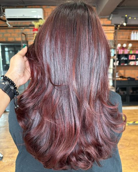 Black dressed girl's mid back length hair cut with coloring combination ...