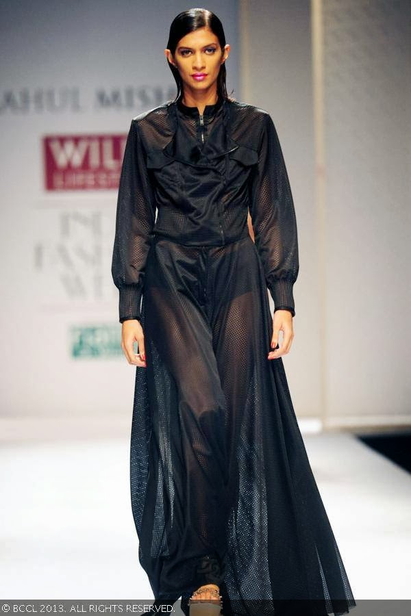 A model walks the ramp for fashion designer Rahul Mishra on Day 2 of the Wills Lifestyle India Fashion Week (WIFW) Spring/Summer 2014, held in Delhi.