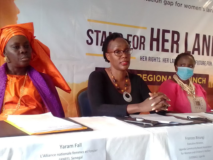 Yaram Fall of Senegal with Frances Birungi of Uganda during the Launch of Stand For Her Land in Nairobi. March 8, 2022.