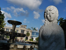 Stature of a woman in front of a fountain at the Songshan Cultural and Creative Park