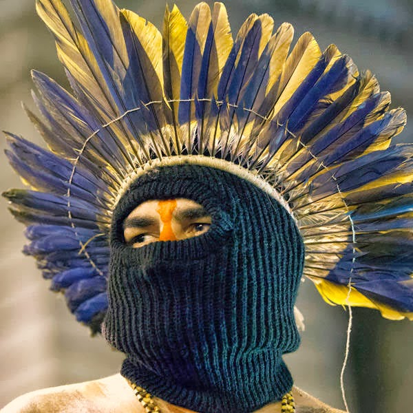 An indigenous man wears a mask during a march in support of teachers on strike in Rio de Janeiro, Brazil.