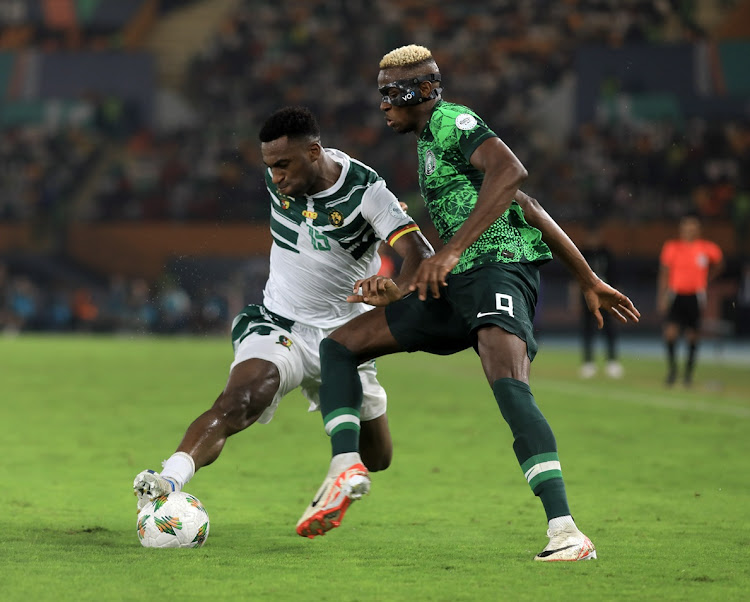 Nigeria's Victor Osimhen is challenges Oumar Gonzalez of Cameroon in the Africa Cup of Nations last 16 match at Stade Felix Houphouet Boigny in Abidjan on Saturday.