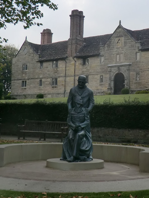 CIMG0665 Sir Archibald McIndoe monument in front of Sackville College