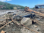 The wreckage of a vehicle is seen amid debris after flash floods swept through towns in the Turkish Black Sea region, in the town of Bozkurt, in Kastamonu province, Turkey, August 14, 2021. 