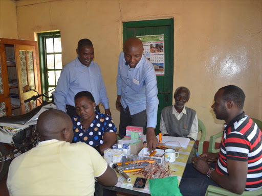 Murang'a senator Irungu Kang'ata (standing right) during the free medical camp at Makuyu social hall.