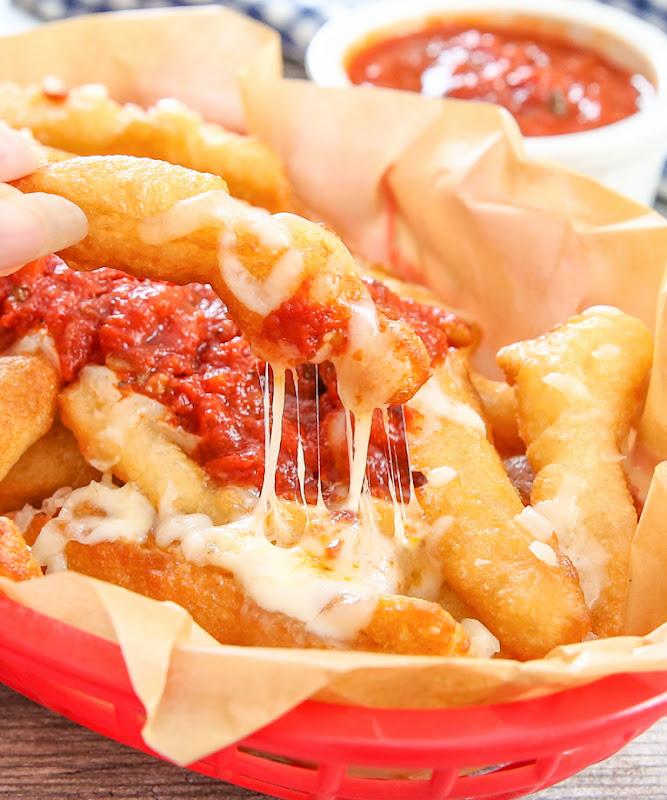 close-up photo of a pizza fry with sauce and cheese