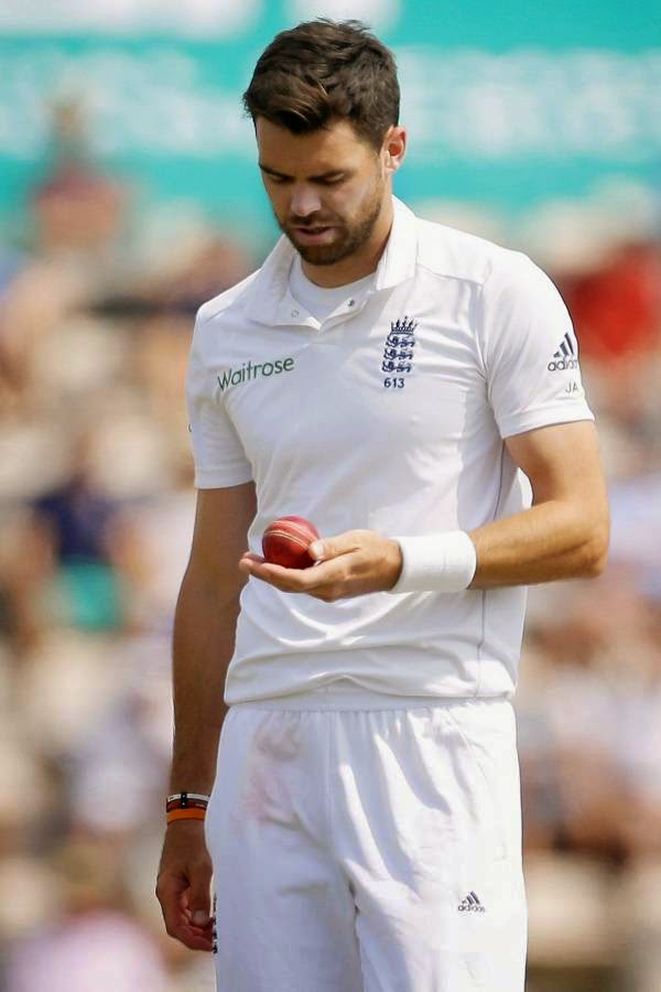 England's James Anderson looks down at the ball as he walks back before beginning his run in to bowl during the fifth and final day of the third cricket Test match of the series between England and India at The Ageas Bowl in Southampton, on July 31, 2014. 