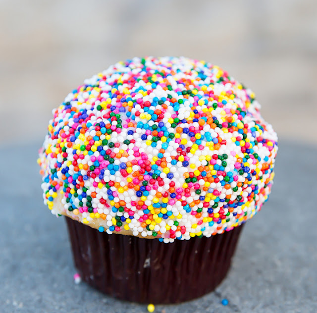 photo of a cupcake with sprinkles