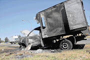 A van burnt by striking truck drivers in Cleveland, east of Johannesburg. File photo.