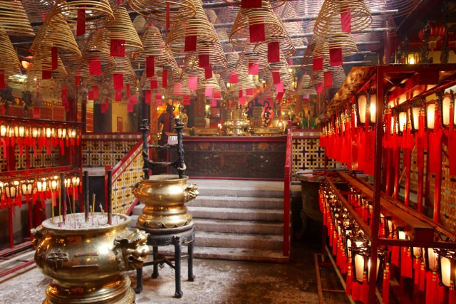 The Mo Man Temple with the incense roof coils and the aroma of wax candles. Hong Kong