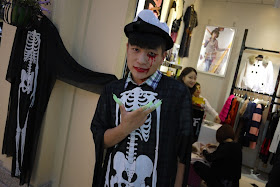 person wearing a skeleton costume at a shop in Changsha, China