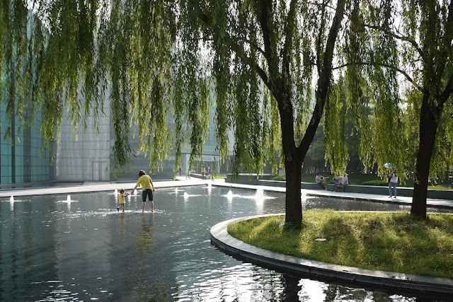 woman and child in a fountain