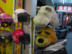 Scooter helmets with a Hello Kitty design, a butterfly design, and furry animal tops