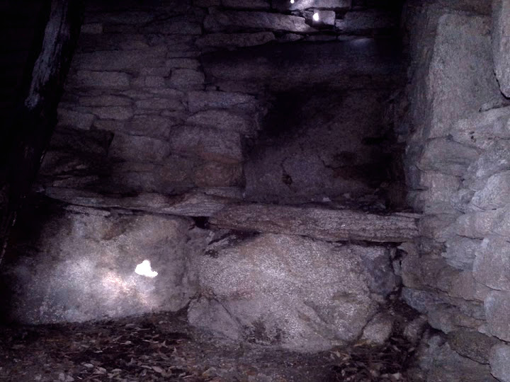 the place inside the old house where they grinded grain to make bread