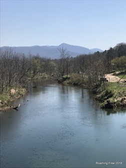 Following the river, with the mountains in the background