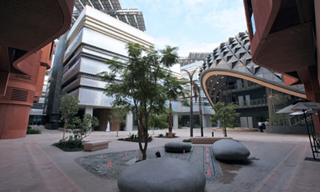 A square within Masdar City. The city has given up on its original aim to emit net zero carbon emissions. Photo: Ali Haider / EPA