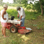 Click to Expand George uses Owen's mow as a tool bench to drill holes in signs.