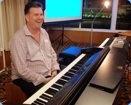 Our Special Guest Artist, Chris Larking, setting-up the Club's Yamaha Clavinova CVP-509. Photo courtesy of Dennis Lyons.