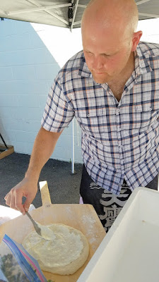 After 10 years of perfecting, the homemade sourdough pizza dough of Paul Willenberg finally made it's public debut for a Seafood Pizza Sunday at Teutonic Winery on July 24th. Here Paul is preparing Clam Pie with Local Crème Fraîche, Manila Clams, Domestic Guanciale, Red Onion