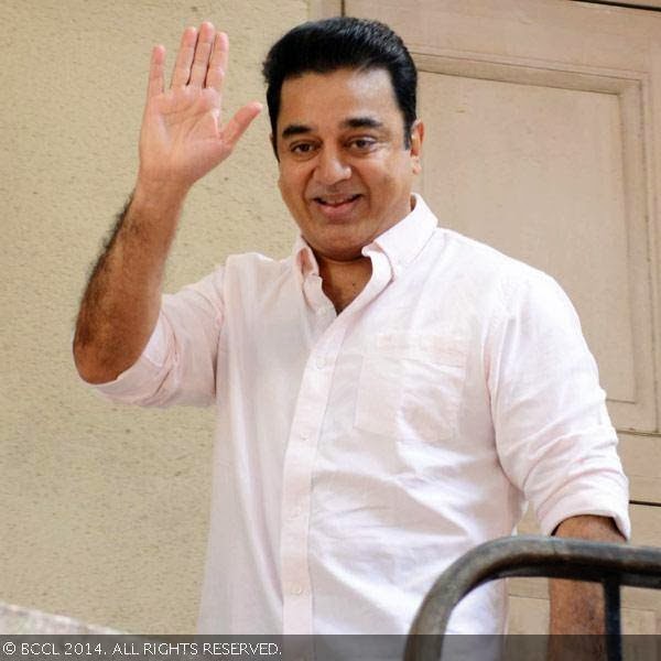 Kamal Hassan waves to media on his arrival for a press meet on being conferred the Padma Bhushan Award, held at his Alwarpet office.