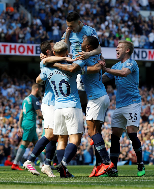 Manchester City's Phil Foden celebrates scoring their first goal with team mates