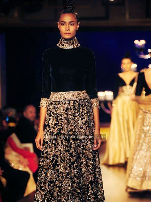 A model walks the ramp for designer Manish Malhotra on Day 4 of India Couture Week, 2014, held at Taj Palace hotel, New Delhi.