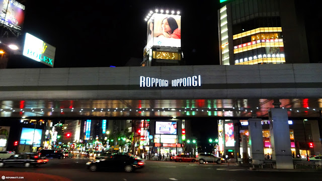 the Neon lights of the Roppongi Crossing in Tokyo, Japan 