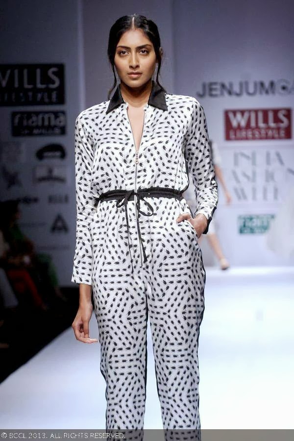 A model walks the ramp for fashion designer Jenjum Gadi on Day 3 of the Wills Lifestyle India Fashion Week (WIFW) Spring/Summer 2014, held in Delhi.