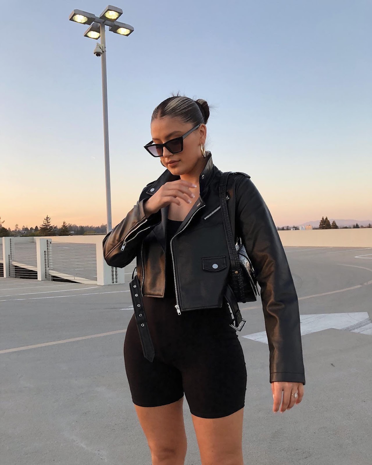 Woman Wearing black Moto jacket
