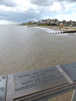 One of the many brass remembrance plates on the rails of Southwold Pier