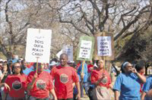 DETERMINED: Sars workers march through Pretoria yesterday. Pic. Peggy Nkomo. 07/09/2009. © Sowetan.