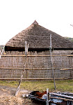 Restored historical house with thatched roof.