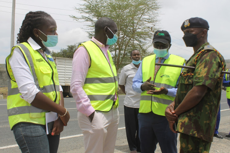 Eastern NTSA regional manager Roseline Oloo, Government Spokesman Cyrus Oguna, NTSA deputy director vehicles inspections Joel Opere and Athi River subcounty police commander Anderson Njagi during a crackdown on Mombasa Road in Athi River, Machakos County, on Friday, February 25, 2022.