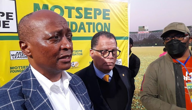 Confederation of African Football president Patrice Motsepe speaks to the media after the ABC Motsepe League final at Olen Park in Potchefstroom with SA Football Association president Danny Jordaan next to him.