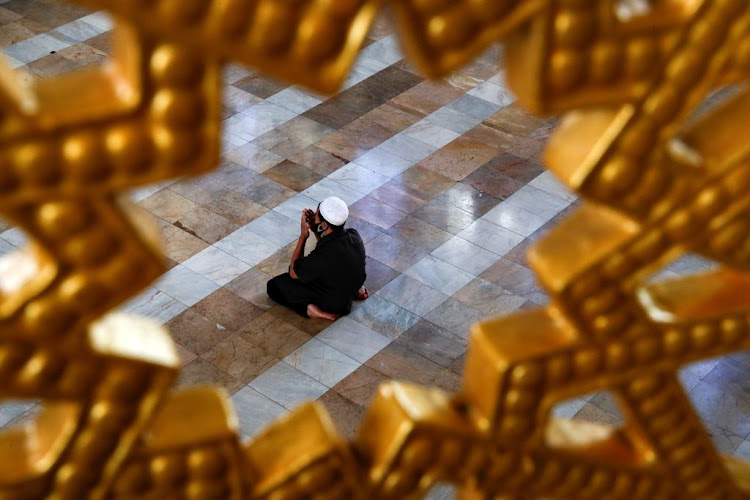 A Muslim man wearing a protective face mask prays at a mosque on the first day of the holy fasting month of Ramadan, amid the Covid-19 outbreak, in Bangkok, Thailand, on April 24 2020.